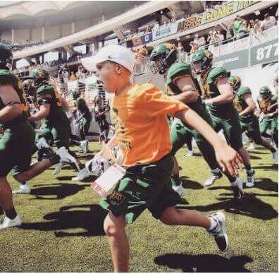 Bryant Rhule running on a Gameday